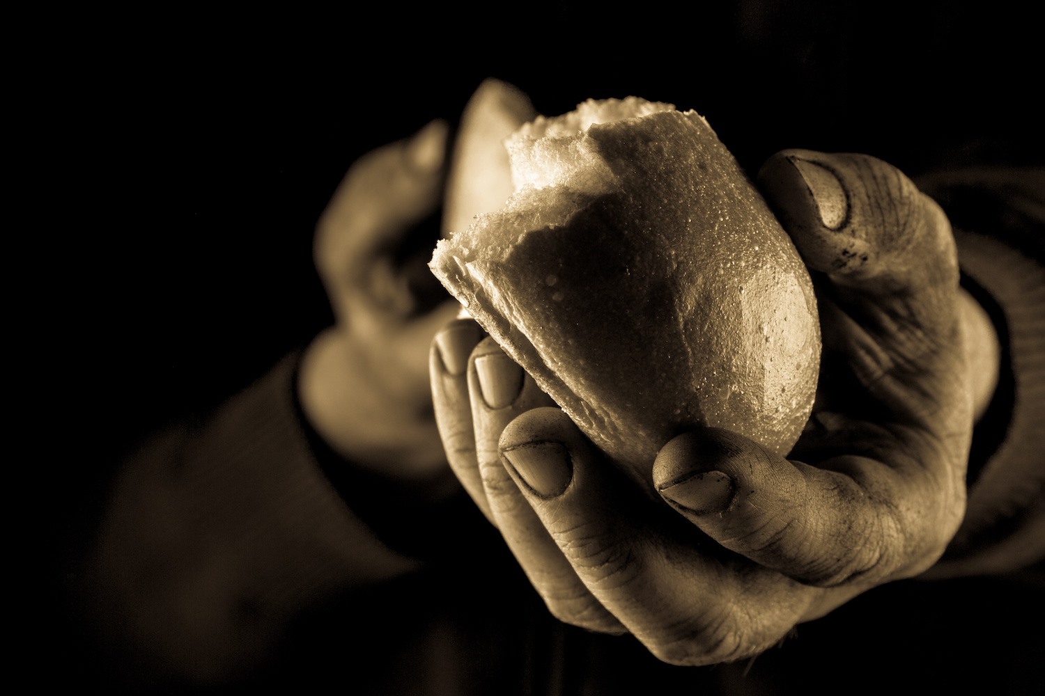 Hand extended to offer bread. Moravian, Hunger & Thirst, Field of Interest, Grant, grants, hungry, MMFA