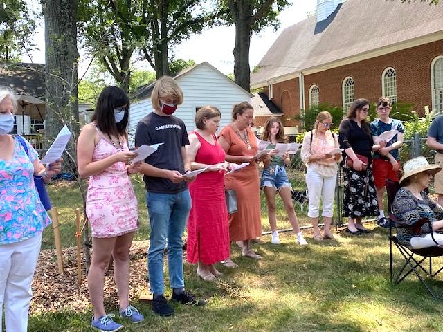 Congregation singing during garden dedication. Grant. MMFA